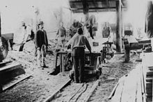 Rossler's Sawmill, 1896 StateLibQld 1 123198 Men working in Rossler's Sawmill at Nerang, ca. 1896.jpg