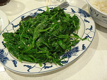 English: Stir-fried pea sprouts Français : Pou...