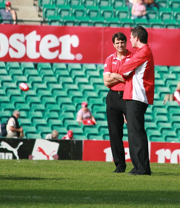 Roos (centre) as Sydney Swans senior coach in 2009