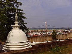 The port of Tangalle;  in the foreground a Buddhist dagoba.