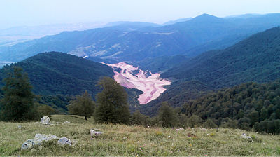 The Teghut Mine (opened in December 2014) contains a copper and molybdenum deposit valued at over US$15 billion and has destroyed over 350 acres of Armenia's little-remaining forested land. The operator of the mine, Vallex Group, will pay only about 10% of revenues in taxes. Teghut Mine 2014.jpg