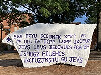 "The Rock" on Sam Sibley Dr. featuring a Caesar Cipher promoting the Demon Cipher Society in September 2022 The NSU Rock (cropped)2.jpg