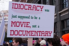 A placard during the 2017 Women's March describing Idiocracy as a "documentary" Trump-WomensMarch 2017-1060585 (31638091963).jpg