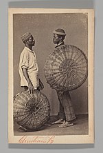 Thumbnail for File:Two Male Street Vendors in Profile with Baskets, Brazil- MET DP-15801-125.jpg