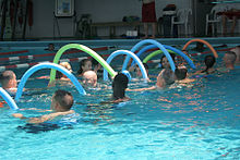 Pool noodles used during an exercise in a U.S. Marine Corps aerobics class USMC-060719-M-3006J-004.jpg