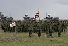 Activation ceremony of the Japanese Amphibious Brigade, 7 April 2018 US Marine Corps photo 180407-M-OP674-046 BLT 1/1 Marines work alongside JGSDF during Japanese Amphibious Rapid Deployment Brigade's unit-activation ceremony.jpg