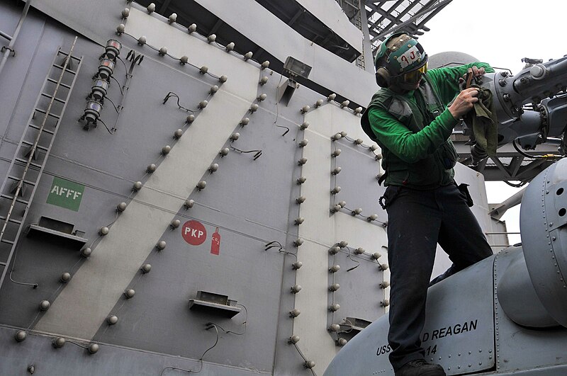 File:US Navy 110710-N-EE987-370 Aviation Machinist's Mate 2nd Class Brandon Rucker, from San Diego, performs routine maintenance on an SH-60F Sea Hawk.jpg