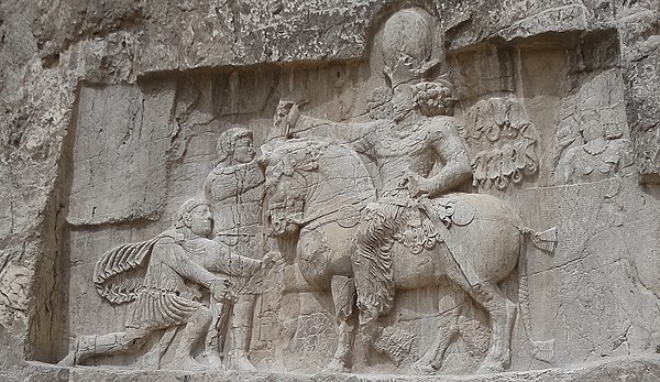 A bas-relief at Naqsh-e Rustam depicting the victory of Sasanian ruler Shapur I over Roman ruler Valerian and Philip the Arab.