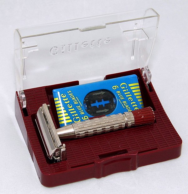 A 1958 Gillette Super Speed razor and a blade dispenser