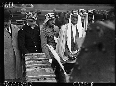 Faisal visiting Camp de Satory in France in 1932 with Saudi officials