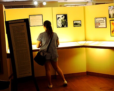 A visitor at Bantayog ng mga Bayani browses through a timeline of the last moments of the protests that culminated in People Power.
