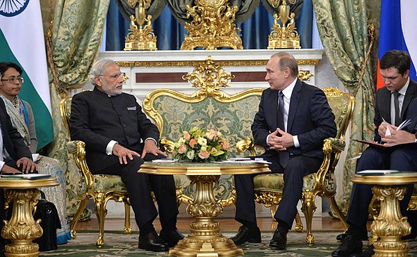 Narendra Modi, Prime Minister of India, and Vladimir Putin, President of Russia, in business suits. Note that Modi is wearing a Jodhpuri with Mandarin