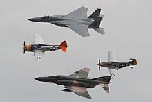 World War II and Cold War -era US aircraft flying in formation during Wings Over Houston at Ellington Airport