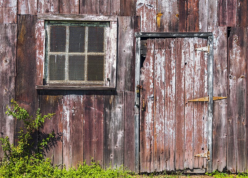 File:Window and door on weathered garage wall.jpg