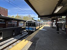 An outbound train departing Wood Island station Wood Island Eastbound MBTA Blue Line Platform, May 2024.jpg