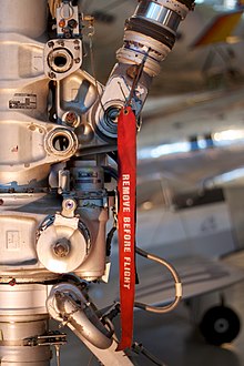 A remove before flight ribbon on Concorde landing gear 'Remove before flight' tag on Concorde F-BVFA.jpg