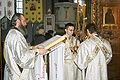 4 Sanok, trikirion and dikirion, being held by subdeacons during the blessing of holy water.jpg