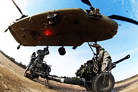 Paratroopers from the 82d Airborne Division Artillery attach a M119A3 Howitzer to a CH-47F Chinook from 3d Battalion, 82d Aviation Regiment during a division artillery readiness test at Fort Bragg, NC, 2016 82nd Airborne Division DART (24260067219).jpg