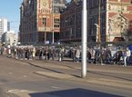 Amsterdam photo of people 2016, free download; people are waiting for the tram at station square in front of Central station. Fons Heijnsbroek, street photography of The Netherlands in high resolution; free image