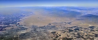 Aerial view of Bakersfield and vicinity, with the Kern River including its source canyon in the southern Sierra Nevadas Bakersfield aerial with Kern River.jpg