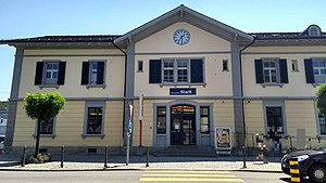 Three-story building with gabled roof