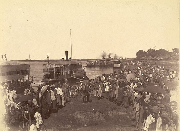 "Where the old flotilla lay". British soldiers disembarking from paddle steamers in Mandalay on 28 November 1885 during the Third Anglo-Burmese War.