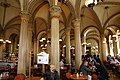 Cafe Central in Vienna interior near entrance with statue of Peter Altenberg