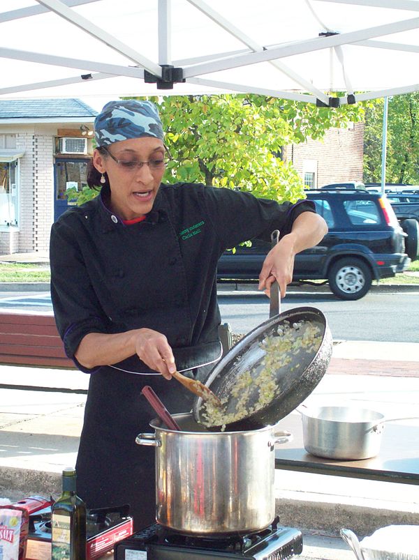 Carla Hall preparing gourmet natural food at the Riverdale Park Farmers Market, October 2009