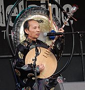 Vietnam, đàn nguyệt literally means "moon string-instrument" (đàn is the generic term for "string instrument" and nguyệt means "moon"). Image taken in Australia, 2017