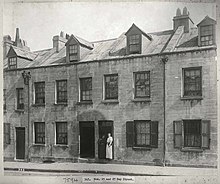 Worker's terraces on Day Street in 1900 featuring dormer windows Day Street, Sydney - after the cleansing operations (3101627634).jpg