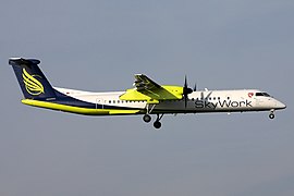 de Havilland Canada DHC-8 авиакомпании SkyWork Airlines в амстердамском аэропорту Схипхол