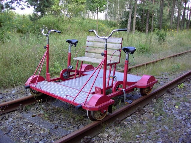 Two-person rail-cycle draisine with four wheels, for leisure.