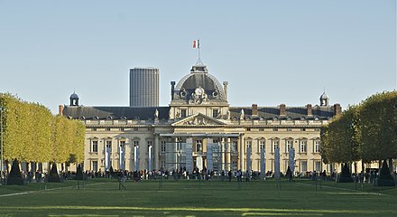 The École militaire, viewed from part of the expanse of the Champs de Mars, the much-loved park that spans the distance to the Eiffel Tower; behind and to the left of the École militaire is the Tour de Montparnasse