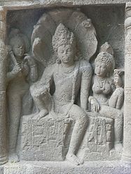Nagaraja in ardhaparyanka asana, with his wife holding lotus and wearing mangalasutra[210]