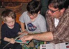 Father and children reading Family Reading Hour.jpg