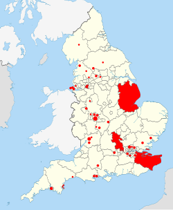 mapa de las autoridades locales inglesas (9 rellenos) con 37 círculos rellenos dispersos