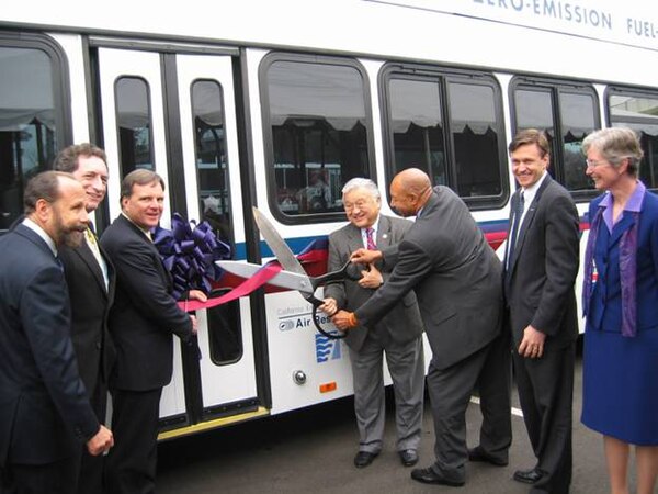 Honda (center) at the August 2006 ribbon-cutting ceremony for the opening of a zero-emissions, hydrogen fuel cell bus program