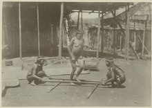 A similar dance to tinikling done by the Kayan in upper mahakam, central Borneo. The photo was taken around 1898 and 1900 A.D. KITLV - 25689 - Demmeni, J. - Kayan woman dancing on a specific beat between rice pistils (kang kep). Upper Mahakam, Central Borneo - 1898-1900.tif