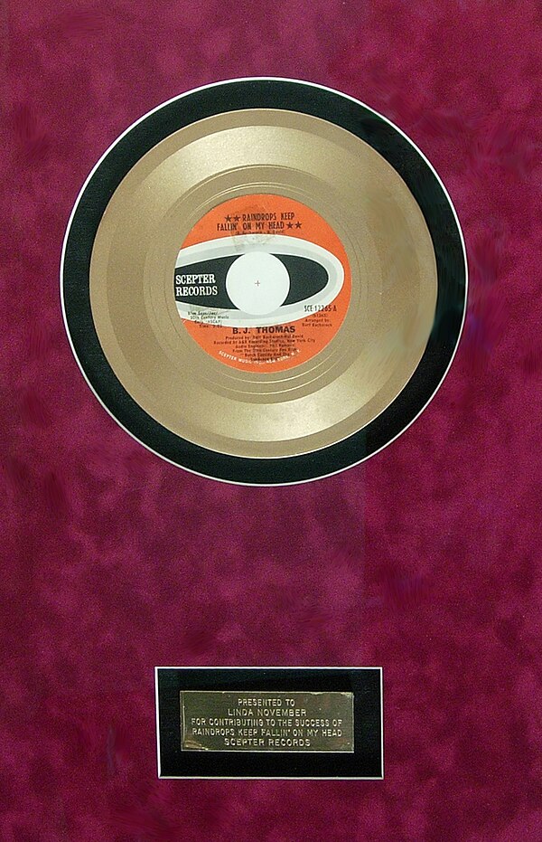 Gold record presented to backup singer Linda November for her work on "Raindrops Keep Fallin' on My Head"