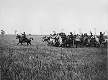 2nd Dragoons (Royal Scots Greys) training in a field in France. Based on the helmets being worn by the men in the photograph, it is probable that the photograph was taken after March 1916 when the Scots Greys received their helmets. This photograph is probably a picture of the regiment training in mounted tactics after being used in a dismounted role in 1914 and 1915 and the first part of 1916. NLS Haig - Royal Scots Greys in France.jpg