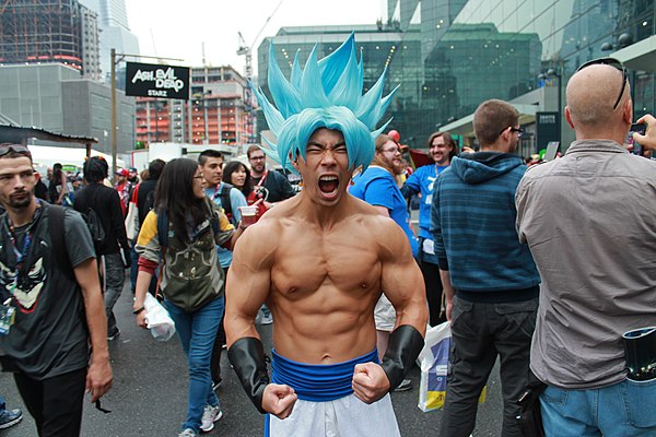A cosplayer re-creating the appearance of Goku in Super Saiyan Blue form