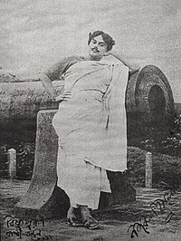 Young Nazrul in-front of Dalmadal Cannon in Bishnupur, Bankura, 1920s