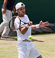 Paul-Henri Mathieu competing in the third round of the 2015 Wimbledon Qualifying Tournament at the Bank of England Sports Grounds in Roehampton, England. The winners of three rounds of competition qualify for the main draw of Wimbledon the following week.