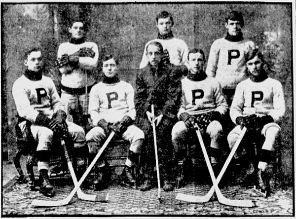 Cameron, seated at far left, with the 1910–11 Pembroke Debaters. Frank Nighbor is seated at far right.