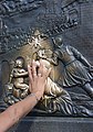 Sculpture plaque in Charles Bridge showing John of Nepomuk falling