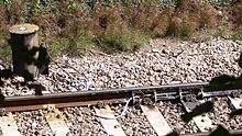 Track lubrication device on a reverse curve in an area prone to movement due to wet beds Rail track lubricator.jpg