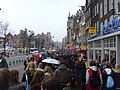 Students on their way to a demonstration, Damrak, Amsterdam