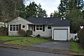 3146 NE 83rd St in the Wedgwood neighborhood, a typical Cape Cod with attached garage.