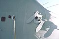 The starboard anchor of the aircraft carrier USS KITTY HAWK (CV-63) is secured in a hawsehole - DPLA - 11f32ff0d6a30892e8cb812072fe9a8e.jpg