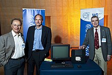 Ben Segal, Tim Berners-Lee, the Next, and Robert Cailliau celebrating the 20th anniversary of Berners-Lee's memorandum, titled "Information Management: A Proposal", to the management at CERN. Trio around Next machine at the 20th anniversary of the World Wide Web's first proposal.jpg